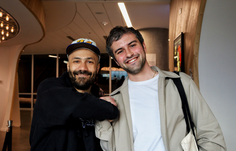 Filmmaker Khalik Allah stands with Cinematic Arts professor Jacob Kessler at the Iowa City Documentary Film Festival.