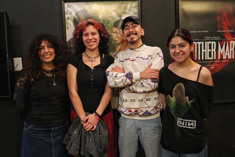 Four attendees of the Iowa City Documentary Film Festival stand together.