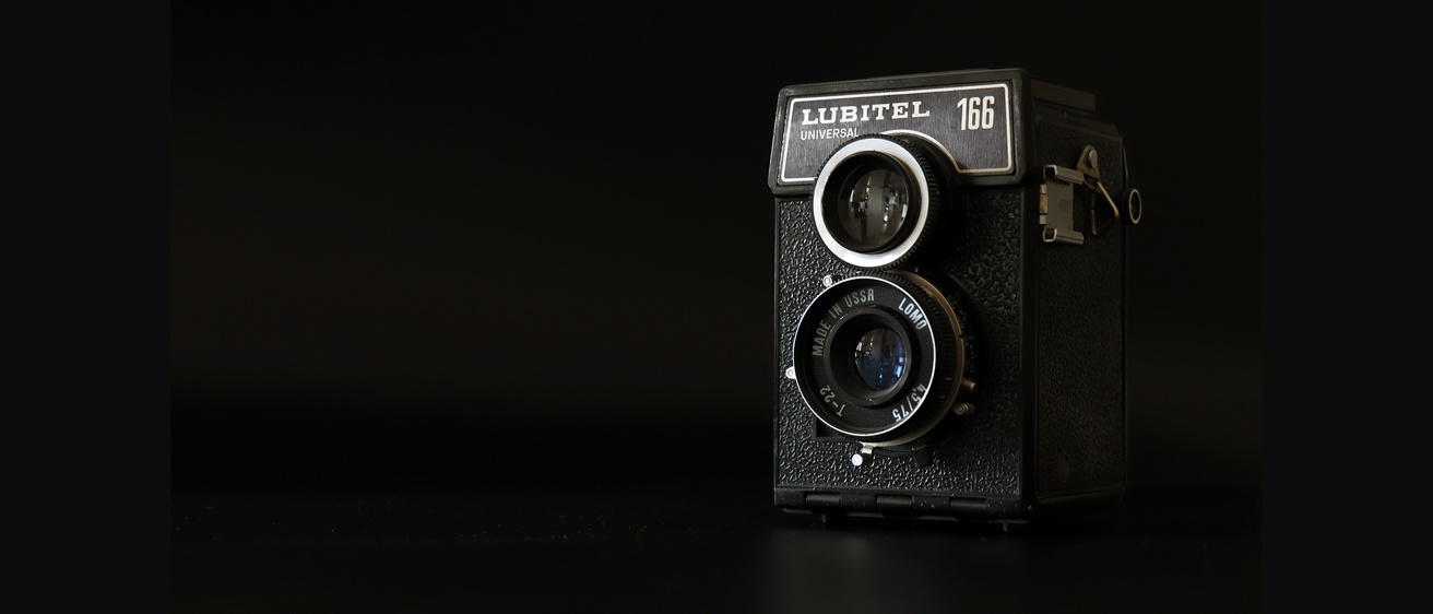 A vintage camera against a dark background